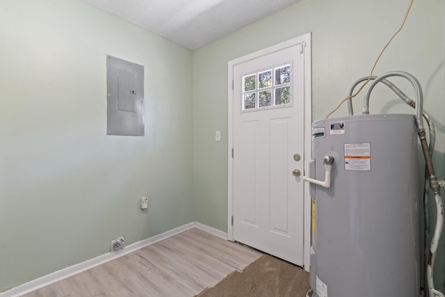 2954 Celeste Dr, Hephzibah, GA 30815 - foyer entrance with water heater, electric panel, baseboards, and light wood-type flooring