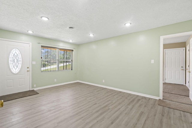 2954 Celeste Dr, Hephzibah, GA 30815 - foyer with wood finished floors, baseboards, recessed lighting, and a textured ceiling