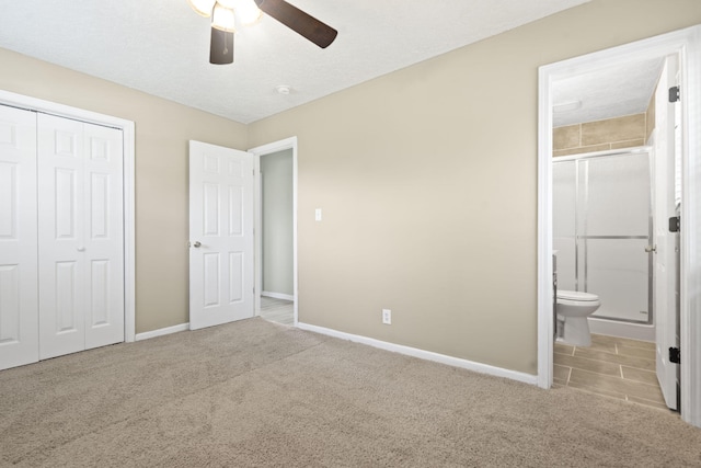 2954 Celeste Dr, Hephzibah, GA 30815 - unfurnished bedroom featuring a closet, baseboards, carpet floors, ensuite bathroom, and ceiling fan