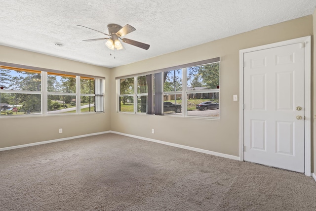 2954 Celeste Dr, Hephzibah, GA 30815 - empty room featuring a ceiling fan, carpet flooring, baseboards, and a textured ceiling