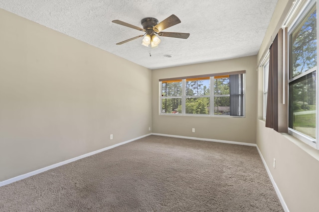 2954 Celeste Dr, Hephzibah, GA 30815 - carpeted empty room with a textured ceiling, baseboards, and ceiling fan