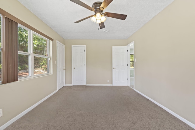 2954 Celeste Dr, Hephzibah, GA 30815 - carpeted empty room with baseboards, a textured ceiling, and ceiling fan