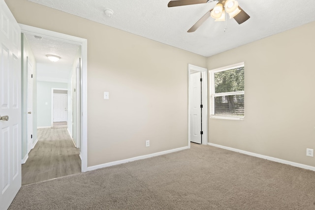 2954 Celeste Dr, Hephzibah, GA 30815 - unfurnished bedroom featuring light carpet, baseboards, and ceiling fan