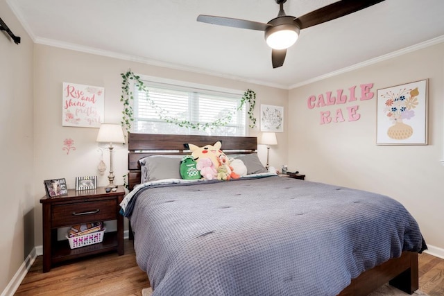 bedroom featuring hardwood / wood-style flooring, ceiling fan, and crown molding