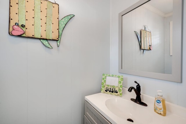 bathroom featuring vanity and crown molding