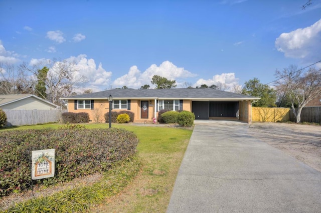 ranch-style house featuring a carport and a front yard