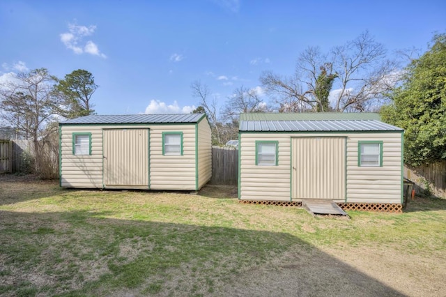 view of outbuilding with a lawn