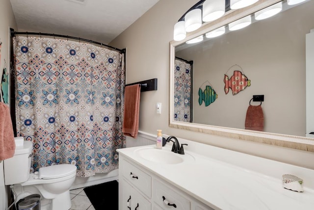 bathroom featuring vanity, curtained shower, tile patterned floors, and toilet