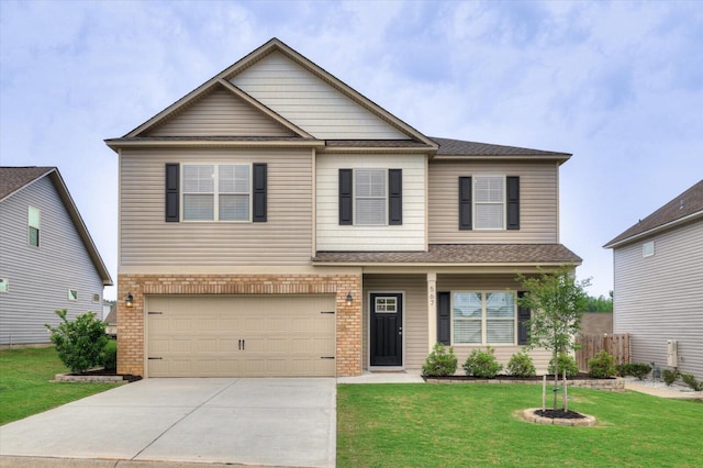 view of front of property with a front lawn and a garage