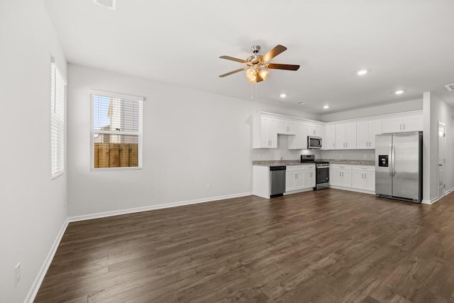 kitchen featuring appliances with stainless steel finishes, dark hardwood / wood-style floors, white cabinetry, and ceiling fan