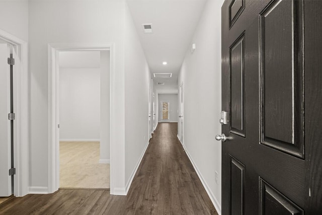 hallway with dark wood-type flooring