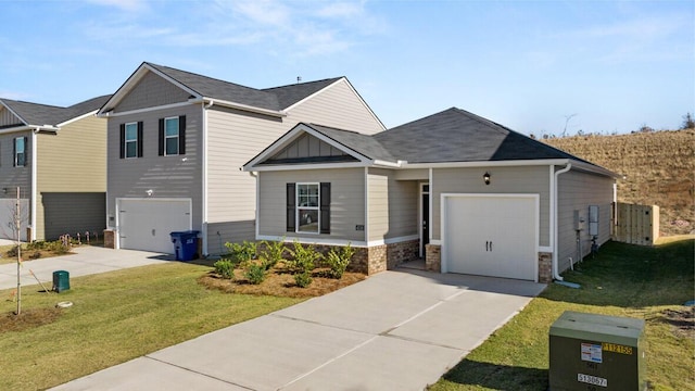 view of front of house with a front yard and a garage