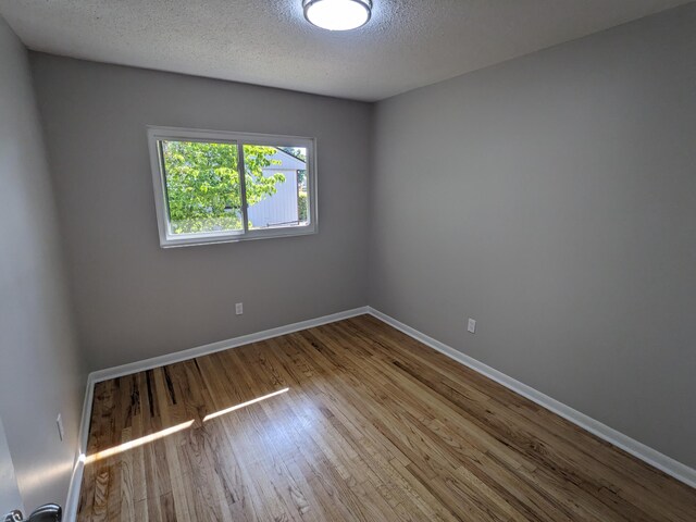 3332 Hillis Rd, Augusta, GA 30906 - unfurnished room featuring a textured ceiling, wood finished floors, and baseboards
