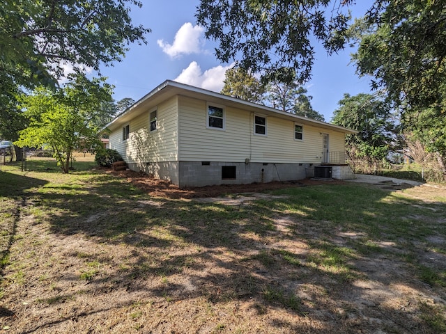 3332 Hillis Rd, Augusta, GA 30906 - back of property featuring central AC unit, a lawn, and crawl space