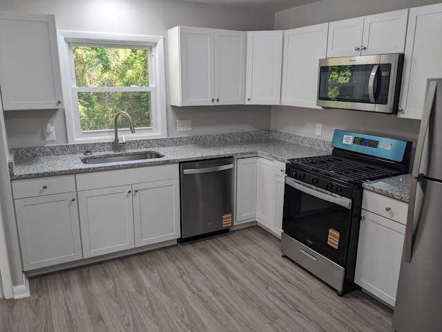 3332 Hillis Rd, Augusta, GA 30906 - kitchen featuring appliances with stainless steel finishes, a sink, and white cabinets