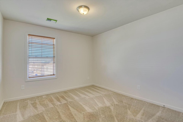 empty room with light colored carpet