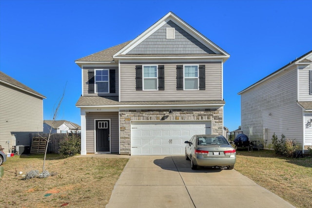 view of front facade featuring a front yard and a garage