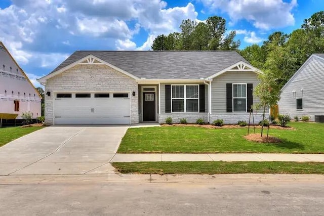 1068 Burlington Dr, Augusta, GA 30909 - view of front of property featuring an attached garage, driveway, a front yard, cooling unit, and stone siding