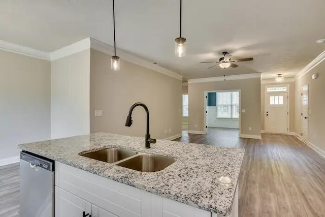 1068 Burlington Dr, Augusta, GA 30909 - kitchen featuring ornamental molding, stainless steel dishwasher, a sink, open floor plan, and a kitchen island with sink