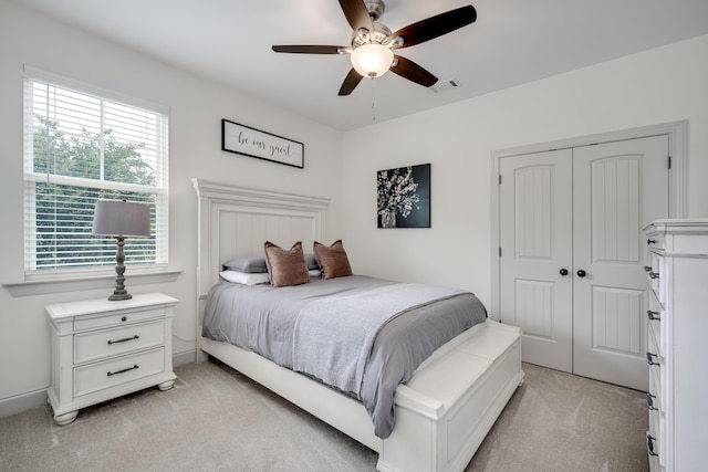 210 Rivernorth Dr, North Augusta, SC 29841 - bedroom with light carpet, a closet, and a ceiling fan