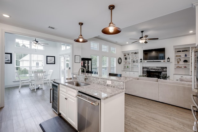 210 Rivernorth Dr, North Augusta, SC 29841 - kitchen featuring stainless steel dishwasher, ceiling fan, beverage cooler, recessed lighting, and pendant lighting