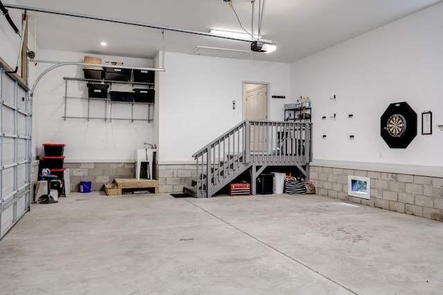 210 Rivernorth Dr, North Augusta, SC 29841 - garage featuring concrete block wall and a garage door opener