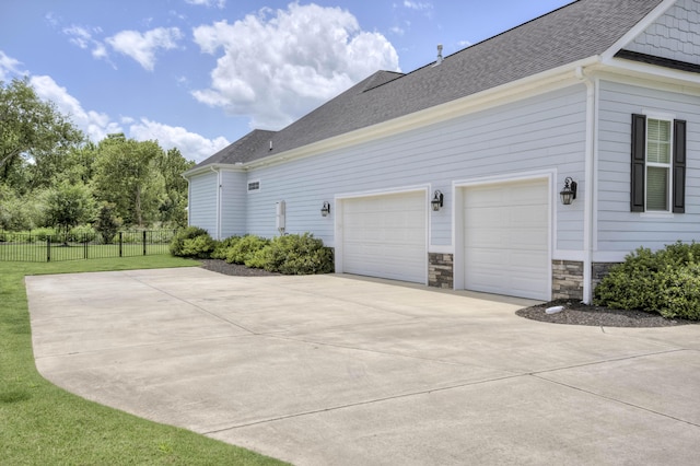210 Rivernorth Dr, North Augusta, SC 29841 - view of home's exterior featuring driveway and roof with shingles