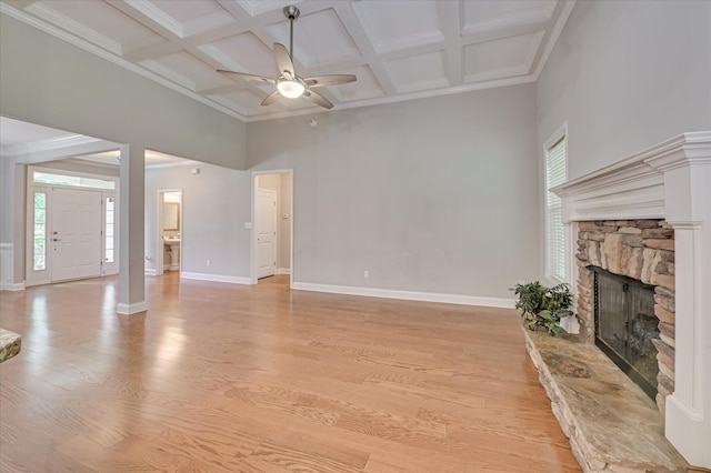 1132 Sumter Landing Cir, Evans, GA 30809 - unfurnished living room featuring a fireplace, a ceiling fan, coffered ceiling, healthy amount of natural light, and baseboards