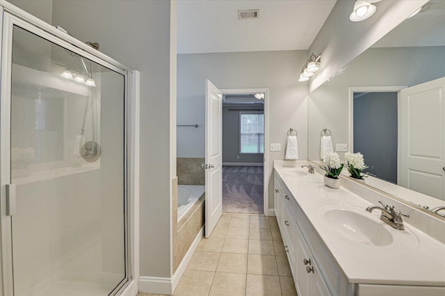 1132 Sumter Landing Cir, Evans, GA 30809 - full bathroom featuring double vanity, tile patterned floors, a shower stall, a garden tub, and baseboards
