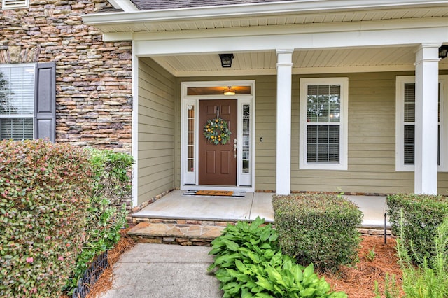 1132 Sumter Landing Cir, Evans, GA 30809 - doorway to property featuring stone siding and a porch