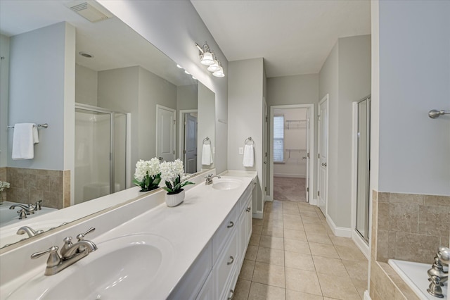 1132 Sumter Landing Cir, Evans, GA 30809 - bathroom with tile patterned flooring, a stall shower, double vanity, and a bath