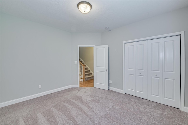 1132 Sumter Landing Cir, Evans, GA 30809 - unfurnished bedroom featuring carpet floors, baseboards, and a closet