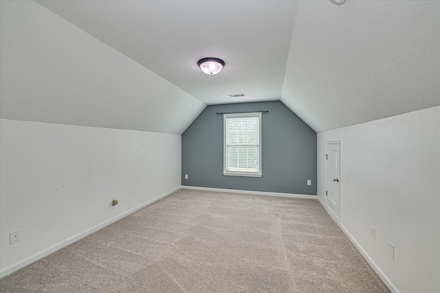 1132 Sumter Landing Cir, Evans, GA 30809 - bonus room with vaulted ceiling, light carpet, and baseboards