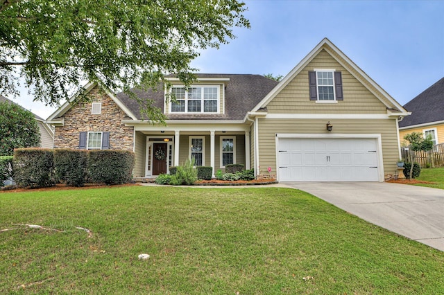 1132 Sumter Landing Cir, Evans, GA 30809 - view of front of property with driveway, a garage, stone siding, a porch, and a shingled roof