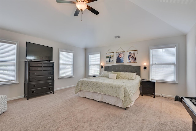 bedroom with baseboards, ceiling fan, light colored carpet, and visible vents