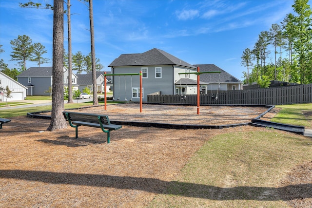exterior space with fence and a residential view