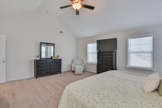 carpeted bedroom with high vaulted ceiling, ceiling fan, baseboards, and visible vents