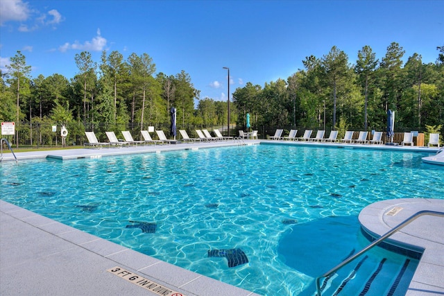 community pool featuring fence