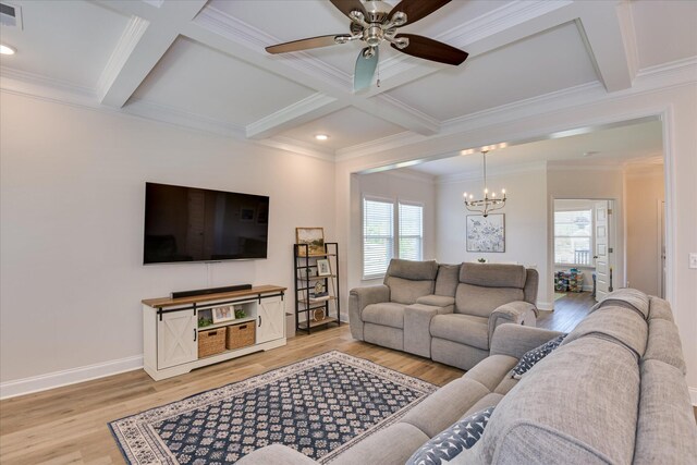 living area with ceiling fan with notable chandelier, beamed ceiling, coffered ceiling, and light wood-style flooring