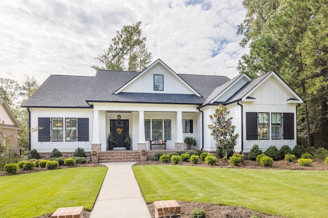 view of front of house featuring a front yard and covered porch