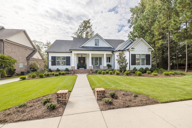 view of front facade featuring covered porch, a front lawn, and cooling unit