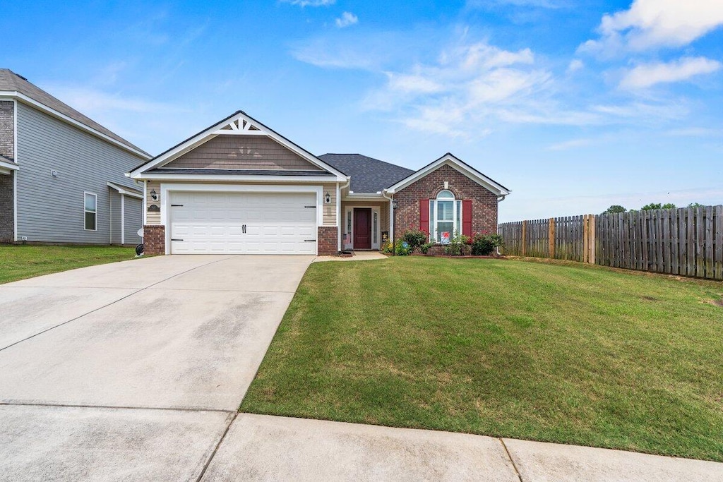 905 Avalon Ct, Grovetown, GA 30813 - view of front facade with brick siding, concrete driveway, and an attached garage