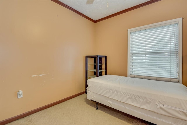 bedroom featuring crown molding, ceiling fan, and carpet