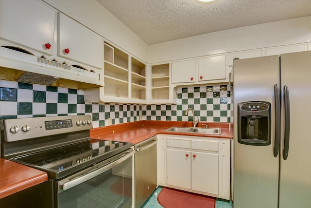 kitchen featuring sink, white cabinets, backsplash, stainless steel appliances, and a textured ceiling