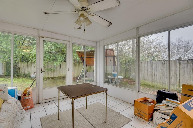 sunroom / solarium featuring ceiling fan