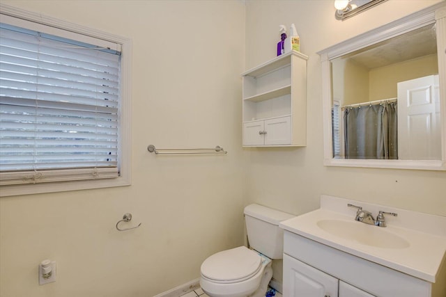 bathroom featuring vanity, toilet, and a shower with shower curtain