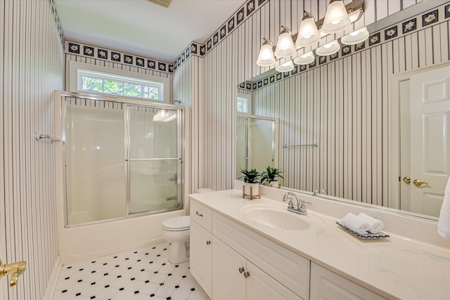 327 Peter Carnes Dr, North Augusta, SC 29860 - full bath featuring wallpapered walls, vanity, toilet, and bath / shower combo with glass door