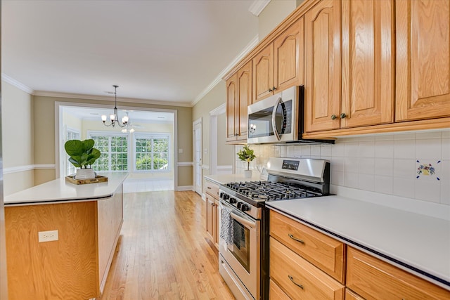 327 Peter Carnes Dr, North Augusta, SC 29860 - kitchen with appliances with stainless steel finishes, light wood-style flooring, backsplash, a chandelier, and crown molding