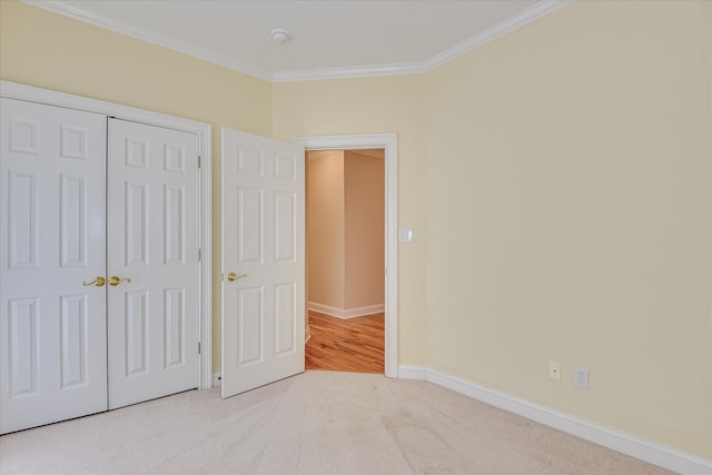 327 Peter Carnes Dr, North Augusta, SC 29860 - unfurnished bedroom with ornamental molding, baseboards, a closet, and carpet flooring