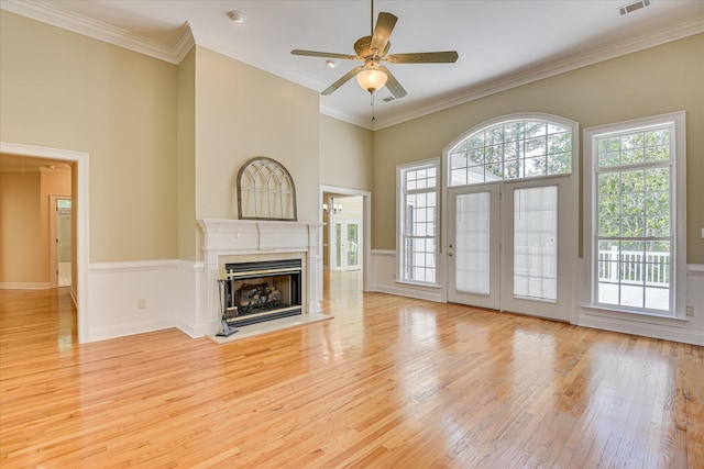327 Peter Carnes Dr, North Augusta, SC 29860 - unfurnished living room with ceiling fan, light wood-style floors, a premium fireplace, a high ceiling, and crown molding